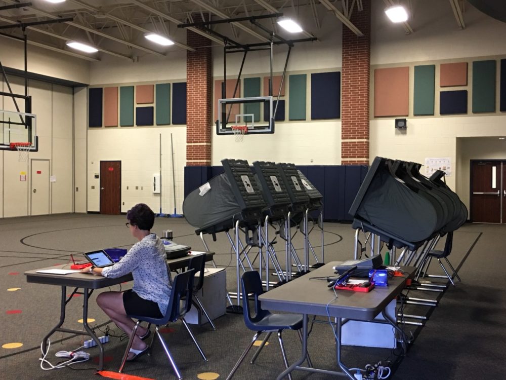 A Harris County election clerk works at the polling location at McNabb Elementary School, in Spring, on election day.