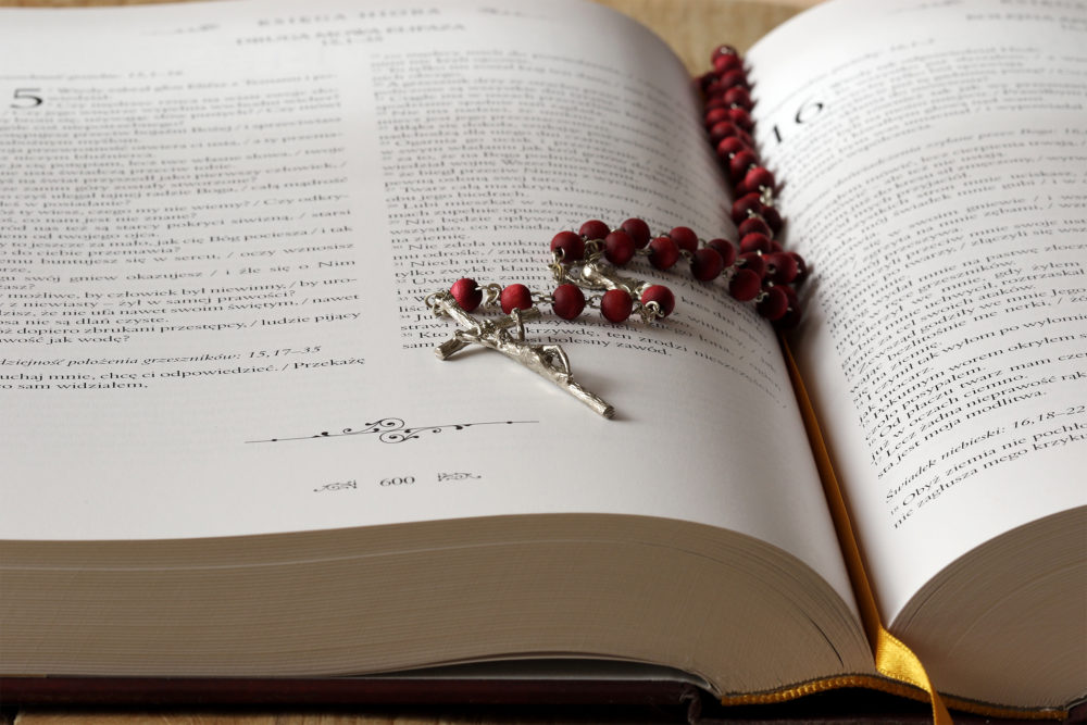 Rosary Beads on a Bible