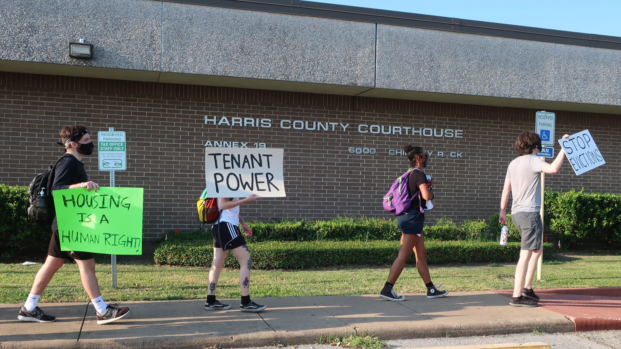 Protesters march Aug. 21 outside a courthouse in Houston, where evictions are continuing despite a moratorium ordered recently by the Centers for Disease Control and Prevention.