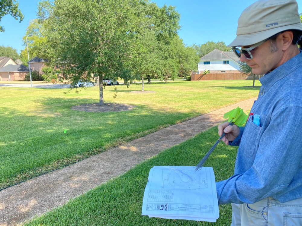 Robert Snoza with the Harris County Flood Control District shows the plans for a rain garden that will be built as part of a pilot project to test their effectiveness at reducing street flooding. It's one of 5 rain gardens planned for around the county.